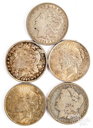 Five silver dollars to include Morgan & Peace