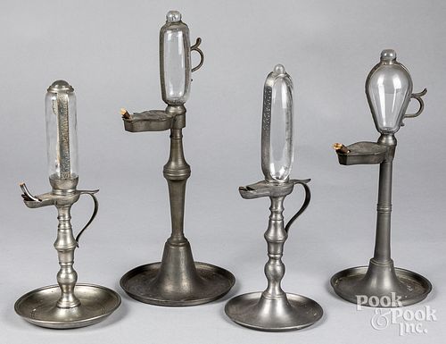 Four pewter whale oil clock lamps, 20th c.