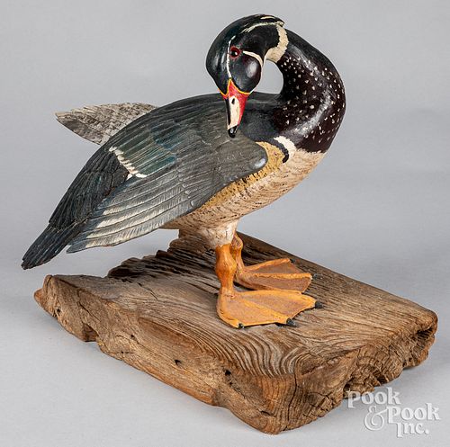 Carved and painted preening wood duck, 20th c.