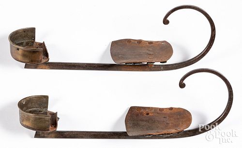 Pair of antique brass and iron ice skates, 19th c.