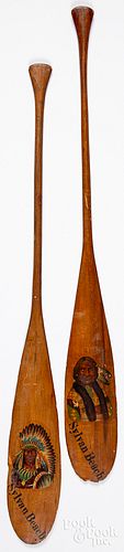 Two souvenir miniature canoe paddles