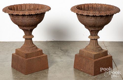 Pair of cast iron garden urns, 19th c.