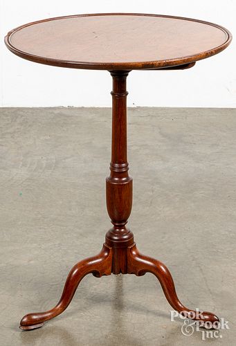 Walnut tilt top candlestand, early 19th c.