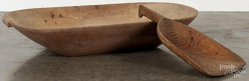 Wooden trencher, 19th c., retaining traces of an old red surface, 4 3/4'' h., 26'' w., 15 1/4'' d.
