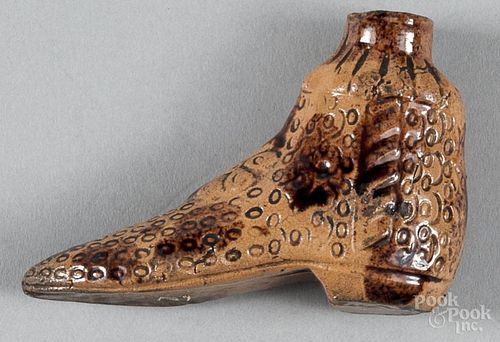 Redware boot bottle, 19th c., with manganese splotching and stamped ovals, 2 1/2'' h.