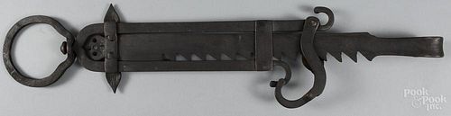 Large wrought iron trammel, 19th c., 40 1/2'' h. Provenance: The Estate of Mark and Joan Eaby