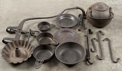 Iron hearth equipment, 19th c., to include a kettle, porringers, etc.
