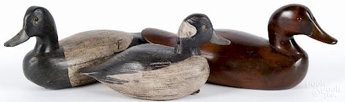Two carved and painted Fred Faith decoys, 20th c., one signed and one branded