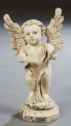 Florentine Style Carved Wood Putto, 19th c., holding a guitar, on an integral stepped octagonal base, with traces of original gilt, H.- 16 in., W.- 9 