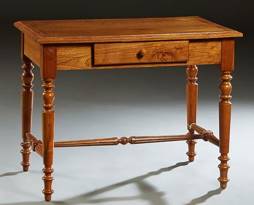French Carved Cherry Louis XVI Style Writing Table, 20th c., the stepped sloping edge top over a frieze drawer, on turned tapered cylindrical legs joi