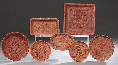 Group of Seven Pieces of Chinese Cinnabar, with relief decoration, consisting of a rectangular bowl, a square bowl, an oval platter, 3 circular platte