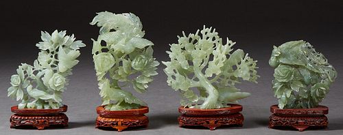 Group of Four Chinese Carved Jade Bird and Floral Figural Groups, 20th c., each on a custom fitted carved mahogany stand, Largest Figure- H. 8 5/8 in.