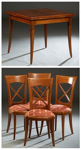 French Louis Philippe Style Carved Cherry Dining Room Suite, 20th c., consisting of a flip top table with a wide skirt, on tapered square saber legs, 