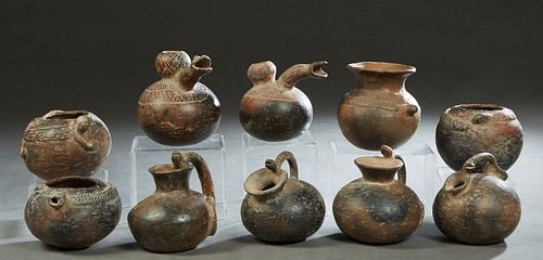 Group of Ten Pre-Columbian Style Pottery Vessels, 20th c., with relief snake decoration, Largest- H.- 7 in., W.- 7 3/4 in., D.- 6 in. Provenance: Palm