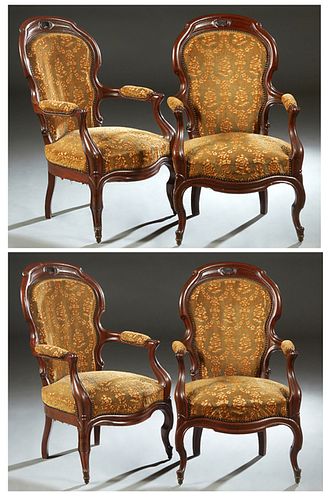 Set of Four French Louis XV Style Carved Mahogany Fauteuils, 19th c., the arched scrolled curved shield shaped upholstered back over upholstered arms,