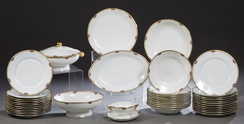 Forty-One Piece Set of Limoges Porcelain Dinnerware, 20th c., by Unique, with gilt rims and floral banding, consisting of 24 dinner plates, 10 soup bo