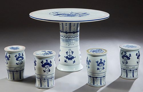 Chinese Five Piece Porcelain Patio Set, 20th c., consisting of a circular table with a pink banded border, around blue floral decoration, together wit