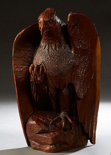 Large Carved Wooden Perched Eagle, 20th c., on an integral base, carved from a single piece of wood, signed with an arrow through two horseshoes on on