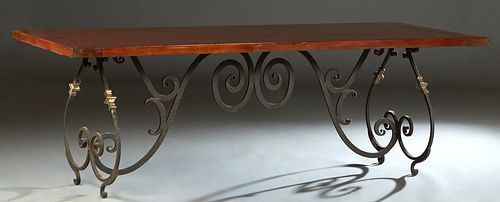Spanish Style Carved Mahogany and Wrought Iron Dining Table, 20th/21st c., the thick top on scrolled wrought iron and brass legs, joined by a scrolled