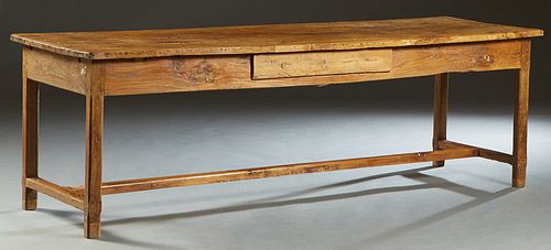 French Provincial Carved Elm Farmhouse Table, 19th c., the four board top over a wide skirt with one frieze drawer on a long side, on square legs join