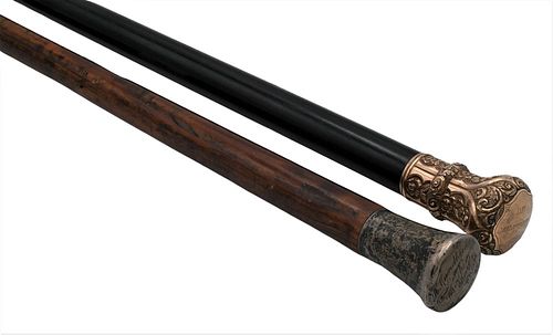 Two Canes, to include one having gold plated top, marked 1827 S. Mundheim 1877, length 36 1/2 inches; along with one having a sterling B. Mundheim 32n