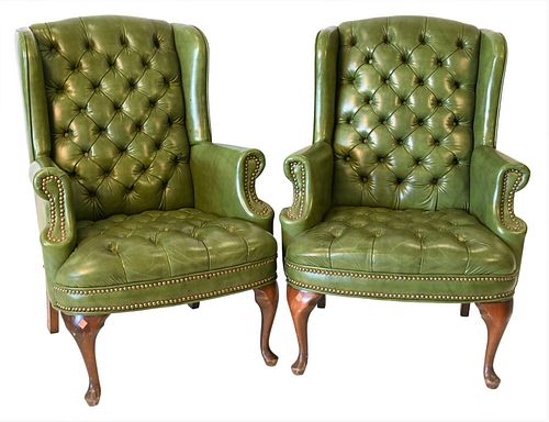 Pair of Green Leather Wing Chairs, having tufted back and seats on Queen Anne legs, height 38 inches, width 28 inches.