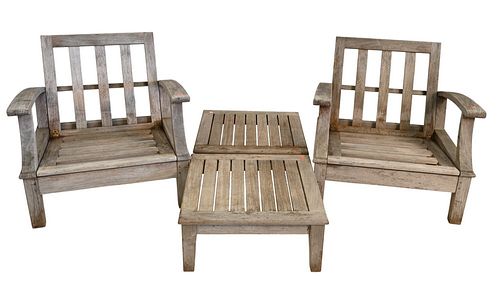 Pair of Gloster Teak Outdoor Armchairs, along with footstools, height 29 inches, width 30 inches.