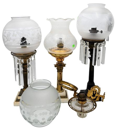 Group of Four Oil Lamps, to include three astro lamps having brass columns, and prisms; along with a wall mounted lamp having etched glass shade, tall