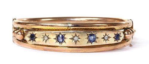 An Edwardian diamond and sapphire hinged bangle, c.1920,