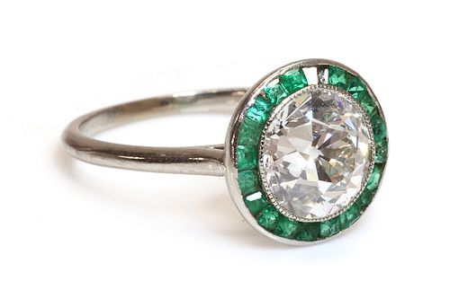 An Art Deco diamond and emerald target ring,