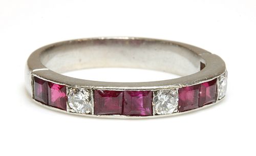 A diamond and ruby half eternity ring,