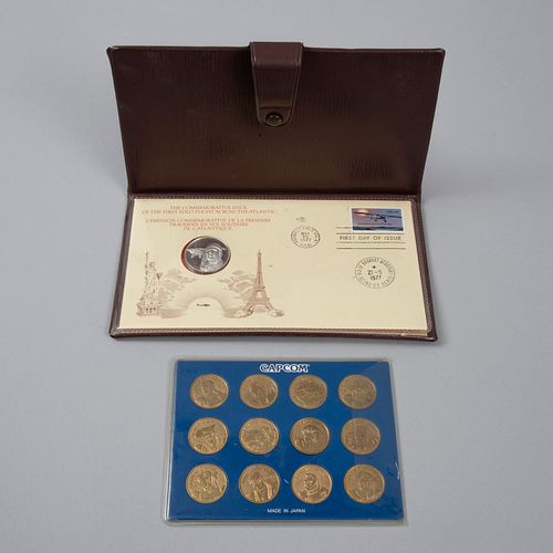 Lote de medalla Charles Lindberg, vuelo transatlántico en plata y estuche, del Franklin Mint y 12 monedas o tokens con personajes.