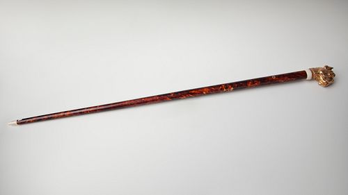 Cane. England, XIX century. 
Silver plated in 18 kts gold and tortoiseshell.