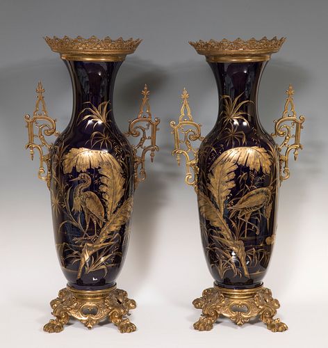 Pair of Vases; France, Napoleon III, nineteenth century. 
Gilt bronze and enameled earthenware SevrÃ©s Bleu du Roi style and gilt,