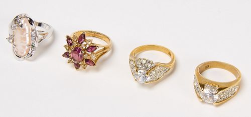 Three 10Kt Gold Rings and Flower Ring