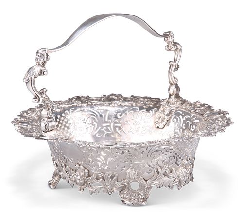 A GEORGE II ROCOCO SILVER CAKE BASKET, by Robert Brown, London 1739, shaped