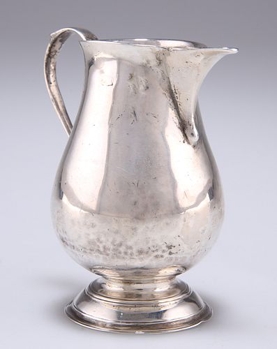 A GEORGE II SILVER CREAM JUG, by Thomas Rush, London 1733, of pitcher form,