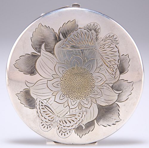 A JAPANESE SILVER AND PARCEL-GILT COMPACT, early 20th Century, circular, ch