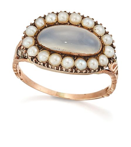 A MOONSTONE, SEED PEARL AND DIAMOND CLUSTER RING, an oval moonstone within 