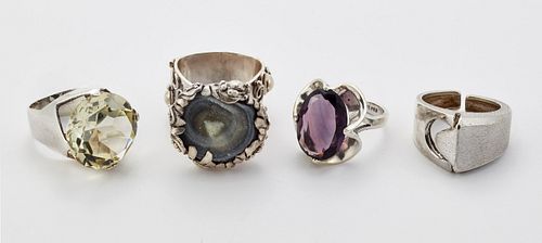 FOUR MODERNIST SILVER RINGS, including A MEXICAN SILVER PURPLE PASTE RING, 