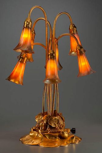 TIFFANY STUDIOS GILT BRONZE AND FAVRILE GLASS SEVEN-LIGHT LILY LAMP