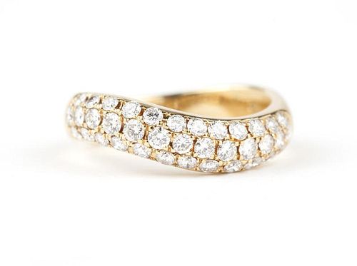 A diamond and 18K gold wave band