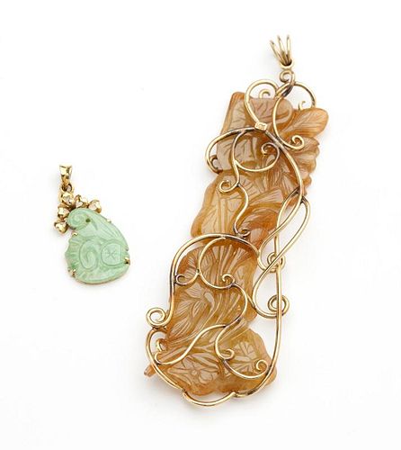 Two carved jade pendants