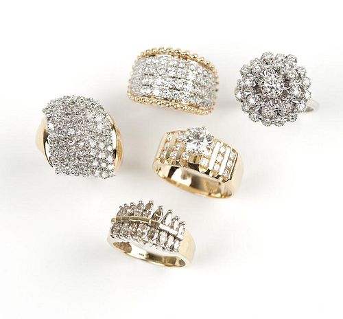 A group of five diamond and gold rings