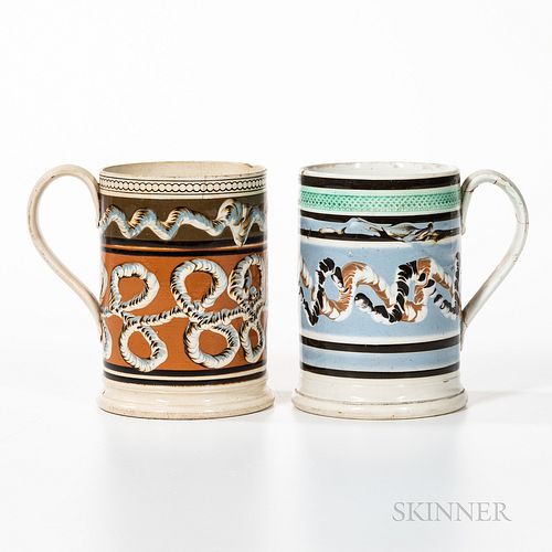Two Slip-decorated Quart Mugs