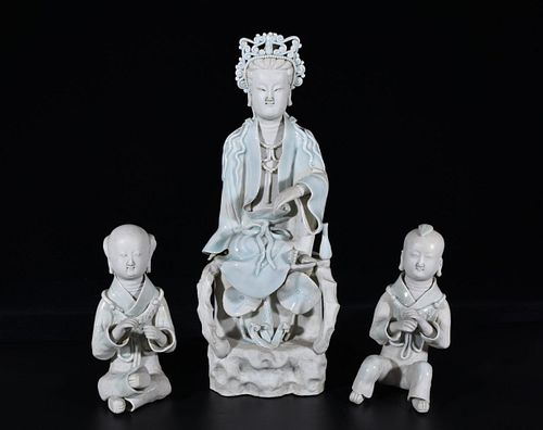 A Group of Blanc De Chine Guanytin Tong Zi Statue