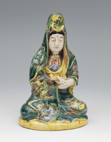 Figure of Guanyin. China, end of XIX century-pps. XX. 
In glazed porcelain.