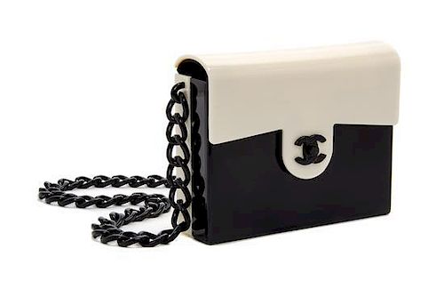 A Chanel Black and White Lucite Handbag, 6.75" x 5.5".