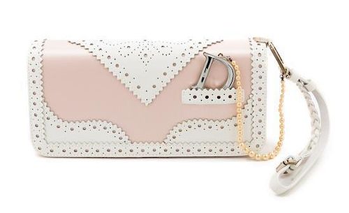 * A Christian Dior Pink and White Wristlet Handbag, 8.5" x 4" x 2".