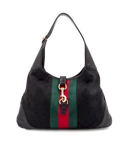 A Gucci Black Jackie Handbag, 15" x 10" x 3".